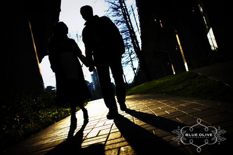 silhouette engagement photo under a bridge